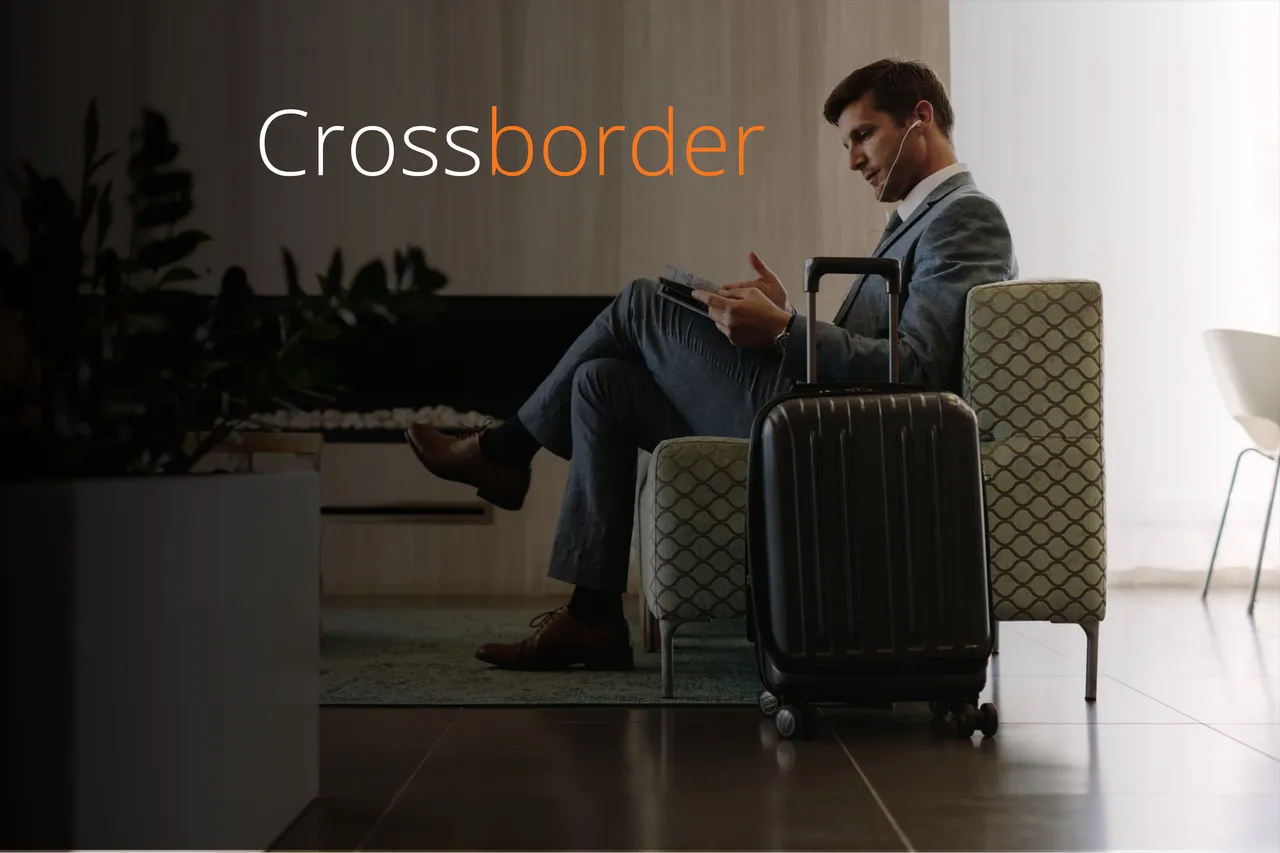 businessman with suitcase sitting in lounge