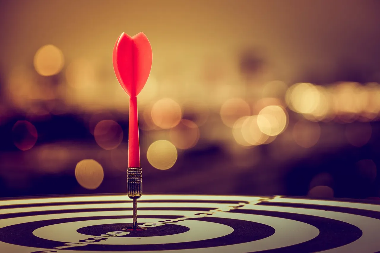 red arrow planted in the center of a target